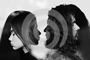 Man and woman profile multiple exposure portrait. Codependency and relationship.
