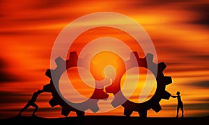 Man and Woman Pushing Gears At Sunset Orange sky. Business Persons Collaborate Together to Connect The Cogwheels.