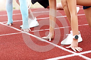 Man and woman racing on outdoor track