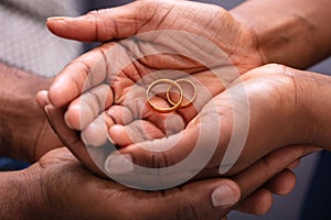 Man And Woman`s Hand With Pair Of Rings