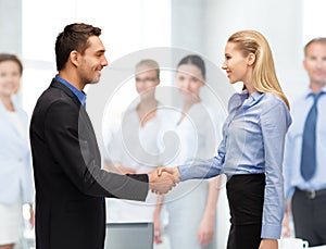 Man and woman shaking their hands