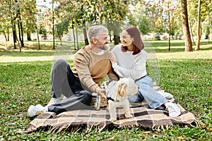 A man and woman sit on