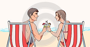 Man and woman sit in deck chairs on sandy beach in front of sea and clink glasses of exotic cocktails, back view