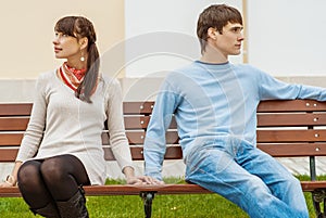 Man and woman sitting on bench