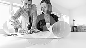 Man with woman sketching architectural project