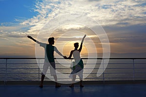 Man and woman standing on deck of cruise ship