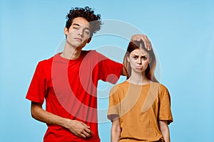 man and woman standing side by side communication fashion modern style blue background