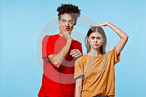 man and woman standing side by side communication fashion modern style blue background
