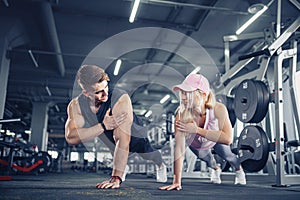 Man and woman strengthen hands at fitness training