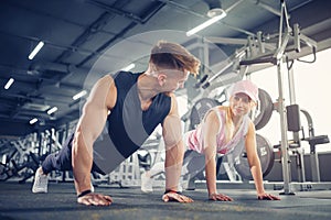 Man and woman strengthen hands at fitness training