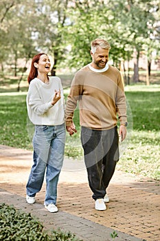 A man and a woman stroll