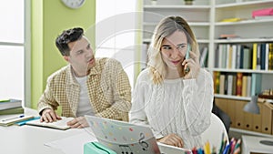 Man and woman students talking on smartphone louder disturbing at library university