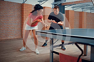 Man and woman on table tennis training, ping pong