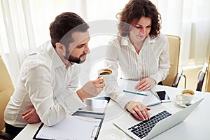 Man and woman team working in the office