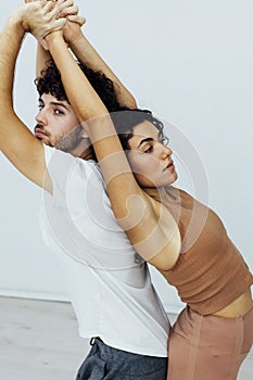 Man and woman together doing exercises family yoga asana fitness