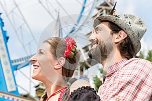Man and woman in Tracht on the Oktoberfest in Munich