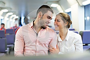 Man and woman travel in train