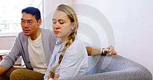 Man and woman upset with each other in living room