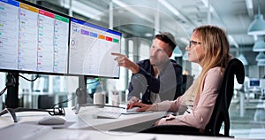 Man And Woman Using CRM Software