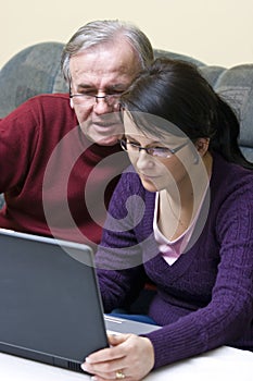 Man and woman using laptop