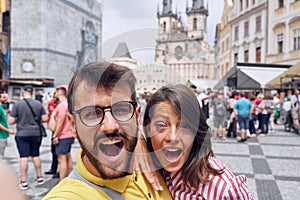 Man and woman in a vacation trip at Prag making selfie