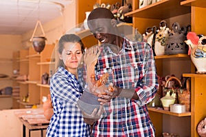 Man and woman visiting pottery shop