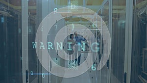 Man and woman walking in server room with moving data security messages