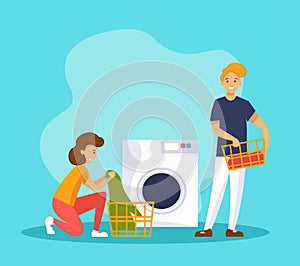 Man and woman wash clothes in a washing maching. Couple doing laundry. Family housework.