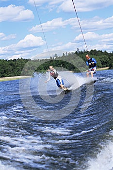 A man and woman water-skiing