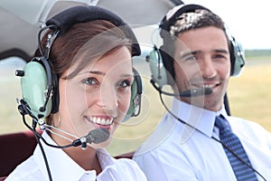 Man and woman wearing headsets