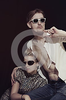 Man and woman wearing sunglasses