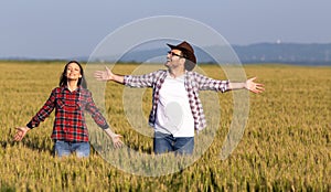 Man and woman in wheat field in summer