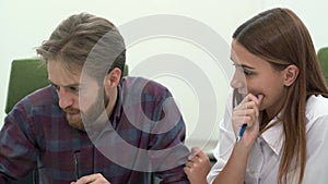 Man and woman work in comfortable modern office discussing close up. Working process