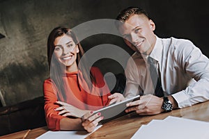 Man and woman work together on business project