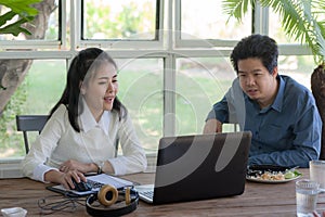 Man and woman workers talking in coffee shop