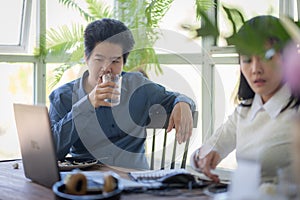 Man and woman workers talking in coffee shop