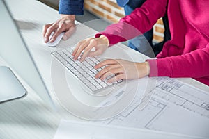 Man and woman working on computer