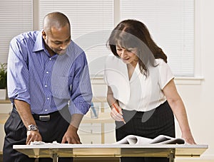 Man and Woman Working in Office