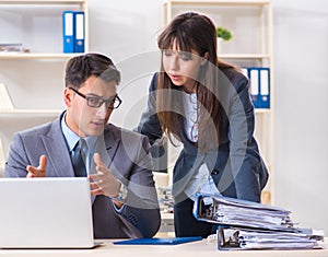 Man and woman working in the office