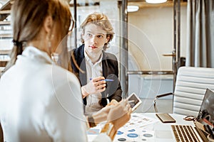 Man and woman working in the office