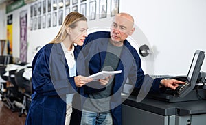 Man and woman working in printshop