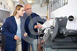 Man and woman working in printshop