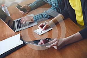 Man and woman working together with laptop