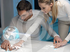 Man and woman working with virtual screens