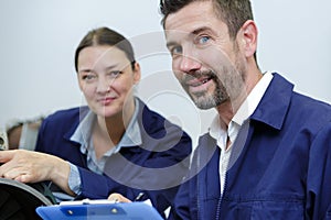 Man and woman working in workshop