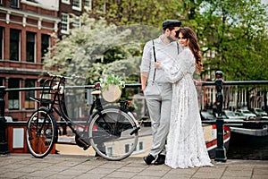 Man and woman or young couple. Summer time. Couple dating on bridge.