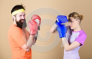 Man and woman in boxing gloves. Boxing sport concept. Couple girl and hipster practicing boxing. Sport for everyone