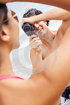 Couple at Beach Filming on Vintage Cine Video Camera photo