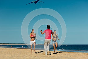 Man and women playing boule on beach photo