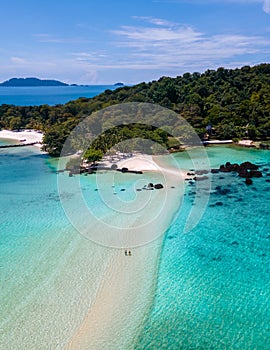 Man and women on a tropical beach in Thailand, Koh Kham Thailand Trat